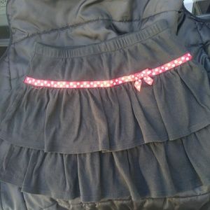 Black ruffle skirt with attached undies. Cotton.